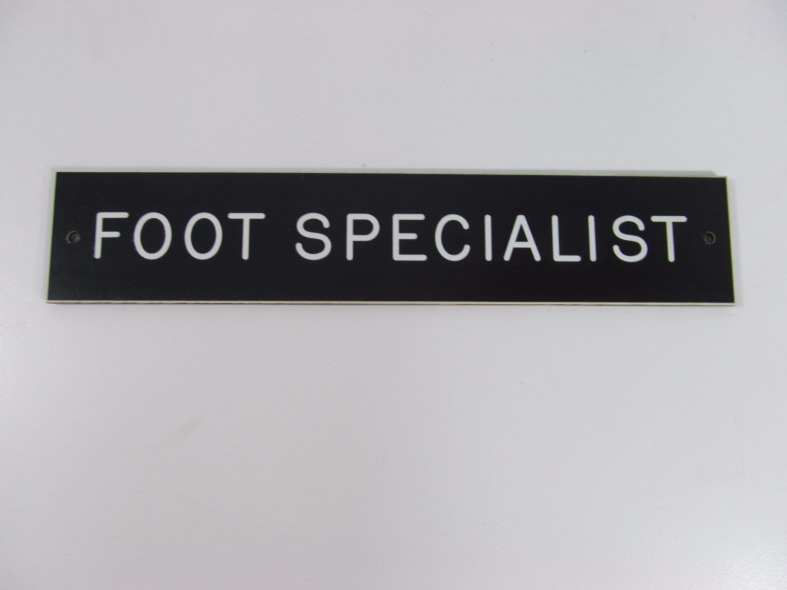 FOOT SPECIALIST SIGN/PLAQUE WALL OR DOOR MOUNTED BLACK PLASTIC 8″ X 1 3/4″