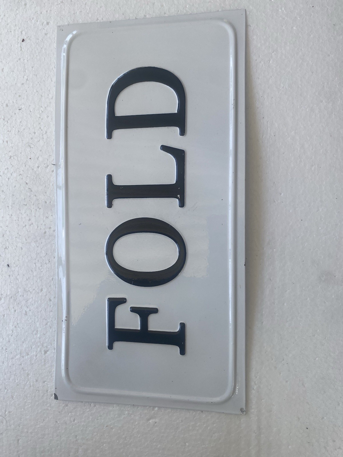 Minimalist White Plastic Wall Sign Plaque FOLD Black Text Glossy Rectangle