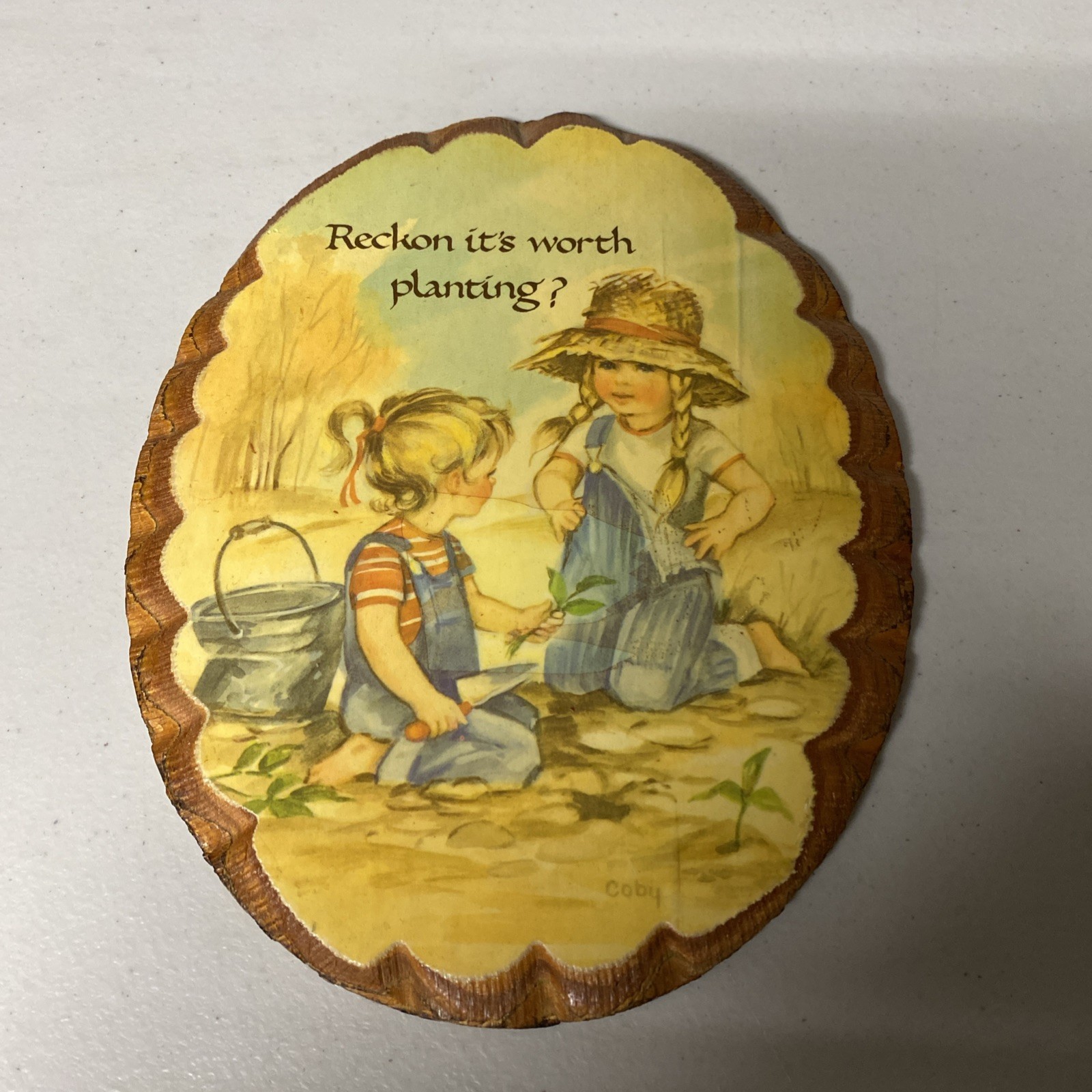 Vintage Wood Plaque “Reckon it’s worth planting?” – Oval 6 1/2 in x 8 1/4 in